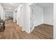 Hallway with light-colored wood floors with a door to an office space at 209 Country Gate Ln, Summerville, SC 29485
