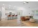Open living room and kitchen with modern wood floors and ample seating at 209 Country Gate Ln, Summerville, SC 29485