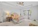 Bright main bedroom with a tray ceiling, large windows, and stylish decor at 209 Country Gate Ln, Summerville, SC 29485
