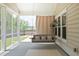 Relaxing screened porch featuring a porch swing at 209 Country Gate Ln, Summerville, SC 29485