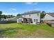 A spacious backyard features a well-maintained lawn, deck, and plenty of space for outdoor activities and relaxation at 216 Goldfinch Ln, Summerville, SC 29485