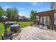 Inviting backyard deck with a wooden pergola, grilling area, and comfortable seating, perfect for outdoor entertaining at 216 Goldfinch Ln, Summerville, SC 29485