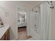 Bathroom featuring a bathtub, shower, and a glimpse into the bedroom, showcasing a clean and functional space at 216 Goldfinch Ln, Summerville, SC 29485