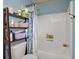 A cozy bathroom features a shower with blue and white shower curtain, providing a functional and inviting space at 216 Goldfinch Ln, Summerville, SC 29485