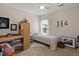 Bright bedroom features neutral walls, a ceiling fan, and a large window overlooking the outdoors at 216 Goldfinch Ln, Summerville, SC 29485