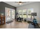 Bright exercise room featuring an elliptical machine, windows and natural light at 216 Goldfinch Ln, Summerville, SC 29485