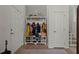 Organized foyer with a coat rack, shoe storage, and tiled floor, providing a functional and welcoming entrance at 216 Goldfinch Ln, Summerville, SC 29485