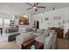 Cozy living area featuring a large sectional sofa, ceiling fan, and open access to the kitchen at 216 Goldfinch Ln, Summerville, SC 29485