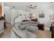 Spacious living room with a large gray sectional, staircase access, and views into other rooms at 216 Goldfinch Ln, Summerville, SC 29485