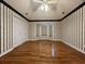 Bedroom with wood floors, tray ceiling, neutral-colored wallpaper and a window bench overlooking the front yard at 2173 Annie Laura Ln, Mount Pleasant, SC 29466