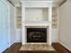 Traditional fireplace with white mantel and built-in shelving, perfect for cozy evenings at 2173 Annie Laura Ln, Mount Pleasant, SC 29466