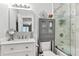 Bright, modern bathroom with marble walls, a glass shower, and updated fixtures showcasing a clean aesthetic at 2317 Tall Sail Dr # 1005, Charleston, SC 29414