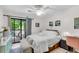 Serene bedroom with a sliding door to a private balcony and bright, natural light at 2317 Tall Sail Dr # 1005, Charleston, SC 29414