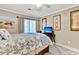 Inviting bedroom with a comfortable bed, ceiling fan and natural light, perfect for rest and relaxation at 2317 Tall Sail Dr # 1005, Charleston, SC 29414