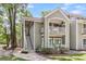 Eye-level exterior of a condo building, with stairs, well-kept bushes, and walkways at 2317 Tall Sail Dr # 1005, Charleston, SC 29414