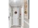 Hallway with white trim, decorative artwork, and a door hanger at 2317 Tall Sail Dr # 1005, Charleston, SC 29414