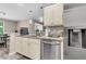 Open kitchen with stainless steel dishwasher, updated cabinets and countertops, and stylish pendant lights at 2317 Tall Sail Dr # 1005, Charleston, SC 29414