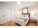 Cozy bedroom with hardwood floors, natural light, closet, and stylish furniture at 2515 Violet Ave, North Charleston, SC 29405