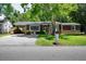 Brick home with a covered parking area with great curb appeal and landscaping at 2515 Violet Ave, North Charleston, SC 29405
