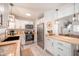 Well-lit kitchen with stainless appliances, butcher block counters, and white cabinetry at 2515 Violet Ave, North Charleston, SC 29405