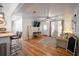 Spacious living room with hardwood floors, ceiling fan, tv and lots of natural light at 2515 Violet Ave, North Charleston, SC 29405