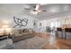 Open-concept living space showcasing hardwood floors and seamless flow to dining and kitchen at 2515 Violet Ave, North Charleston, SC 29405