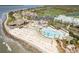 Aerial view showcasing community beach access, pools, and luxury amenities for resort-style living at 2655 Gnarled Pine, Seabrook Island, SC 29455