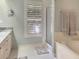 This bathroom features a marble countertop, shower, tub, and window with wooden shutters at 2655 Gnarled Pine, Seabrook Island, SC 29455