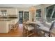 Cozy dining area with ample natural light, rattan pendant lighting, and seating for four at 2655 Gnarled Pine, Seabrook Island, SC 29455