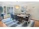 Chic dining room with contemporary furnishings, a unique light fixture, and plenty of natural light at 2655 Gnarled Pine, Seabrook Island, SC 29455