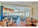 Inviting dining room with hardwood floors, ample seating, and scenic views, ideal for entertaining guests at 2655 Gnarled Pine, Seabrook Island, SC 29455