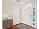 Bright foyer with white doors, a transom window, a stylish cabinet, and rich hardwood flooring at 2655 Gnarled Pine, Seabrook Island, SC 29455