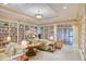 Cozy library with extensive bookshelves, comfortable seating, and warm lighting, creating a perfect reading space at 2655 Gnarled Pine, Seabrook Island, SC 29455