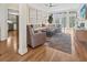 Spacious living room with a comfortable sectional sofa, modern ceiling fan, and natural light at 2655 Gnarled Pine, Seabrook Island, SC 29455