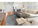 Inviting living room featuring neutral decor, a plush rug, comfortable seating, and an open floor plan at 2655 Gnarled Pine, Seabrook Island, SC 29455