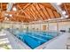 Indoor pool with soaring wood ceilings and ample natural light, great for swimming laps and fitness at 2655 Gnarled Pine, Seabrook Island, SC 29455