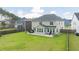 Spacious backyard with a patio area, surrounded by lush green grass and a privacy fence at 283 Saxony Loop, Summerville, SC 29486