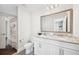 Bathroom with double sink vanity featuring granite countertops and white cabinetry at 283 Saxony Loop, Summerville, SC 29486