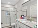 Bathroom featuring white vanity, granite countertop, glass shower, and tile walls at 283 Saxony Loop, Summerville, SC 29486