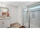 Bathroom view showcasing glass-enclosed shower and tiled floor at 283 Saxony Loop, Summerville, SC 29486