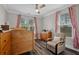 Bright Bedroom with wood-look flooring, neutral walls, and glider chair at 283 Saxony Loop, Summerville, SC 29486