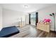 Bright bedroom with hardwood floors, natural light, and a dresser with stuffed animals at 283 Saxony Loop, Summerville, SC 29486