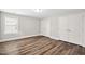 Empty bedroom featuring wood floors, neutral walls, and plenty of closet space at 283 Saxony Loop, Summerville, SC 29486