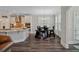 Breakfast nook with a dark table is adjacent to a bright, well-appointed kitchen area at 283 Saxony Loop, Summerville, SC 29486