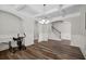 Open dining room with coffered ceiling and staircase in the background at 283 Saxony Loop, Summerville, SC 29486