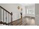 Inviting foyer showcasing hardwood floors and decorative wall accents at 283 Saxony Loop, Summerville, SC 29486