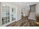 Elegant foyer with hardwood floors, French doors, and staircase at 283 Saxony Loop, Summerville, SC 29486