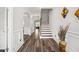 Bright foyer featuring hardwood floors, a staircase, and elegant trim work at 283 Saxony Loop, Summerville, SC 29486