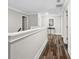 Bright hallway with wood floors and white trim accents at 283 Saxony Loop, Summerville, SC 29486