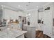 Beautiful kitchen with white cabinetry, granite countertops, and stainless steel appliances at 283 Saxony Loop, Summerville, SC 29486
